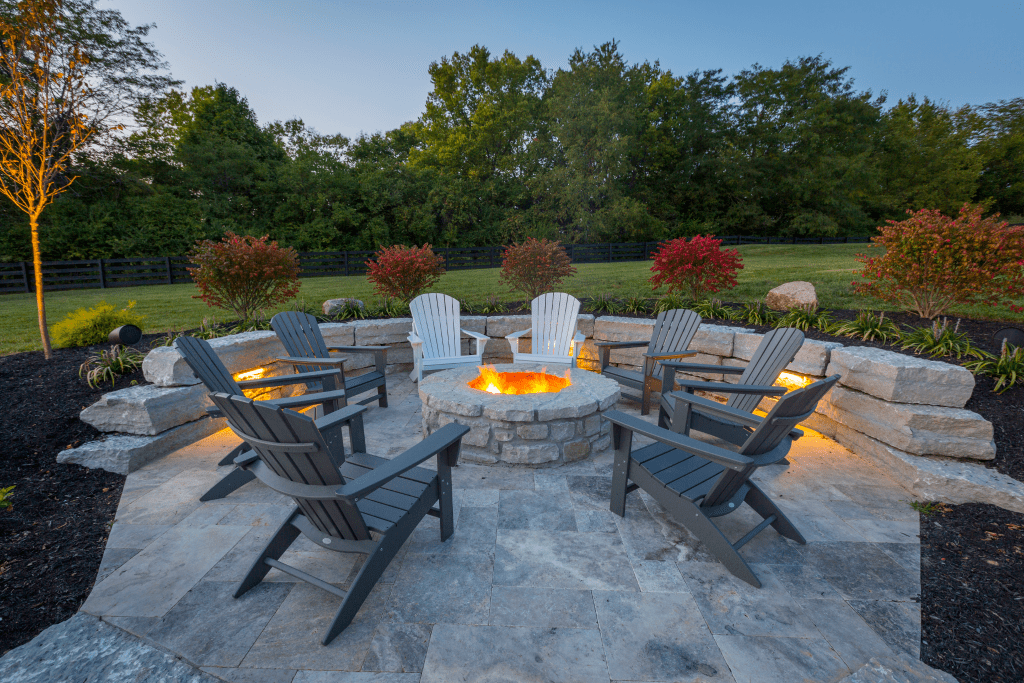 Fire pit and chairs with stone wall