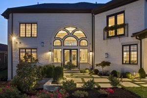 whitebrick house with black windows