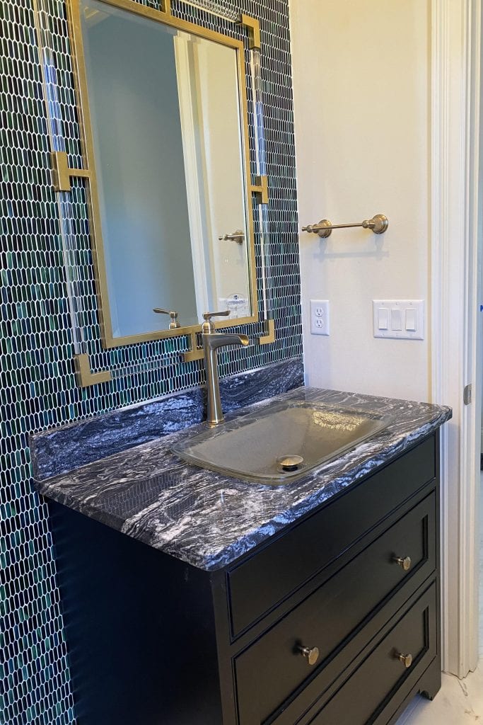 family powder room with glass mosaic tile new construction